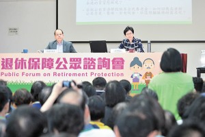 Mrs Lam (right) listens to public views at the for