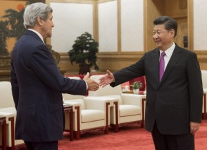 Chinese President Xi Jinping (R) shakes hands with U.S. Secretary of State John Kerry prior to a meeting at the Great Hall of the People in Beijing, China June 7, 2016. REUTERS/Saul Loeb/Pool